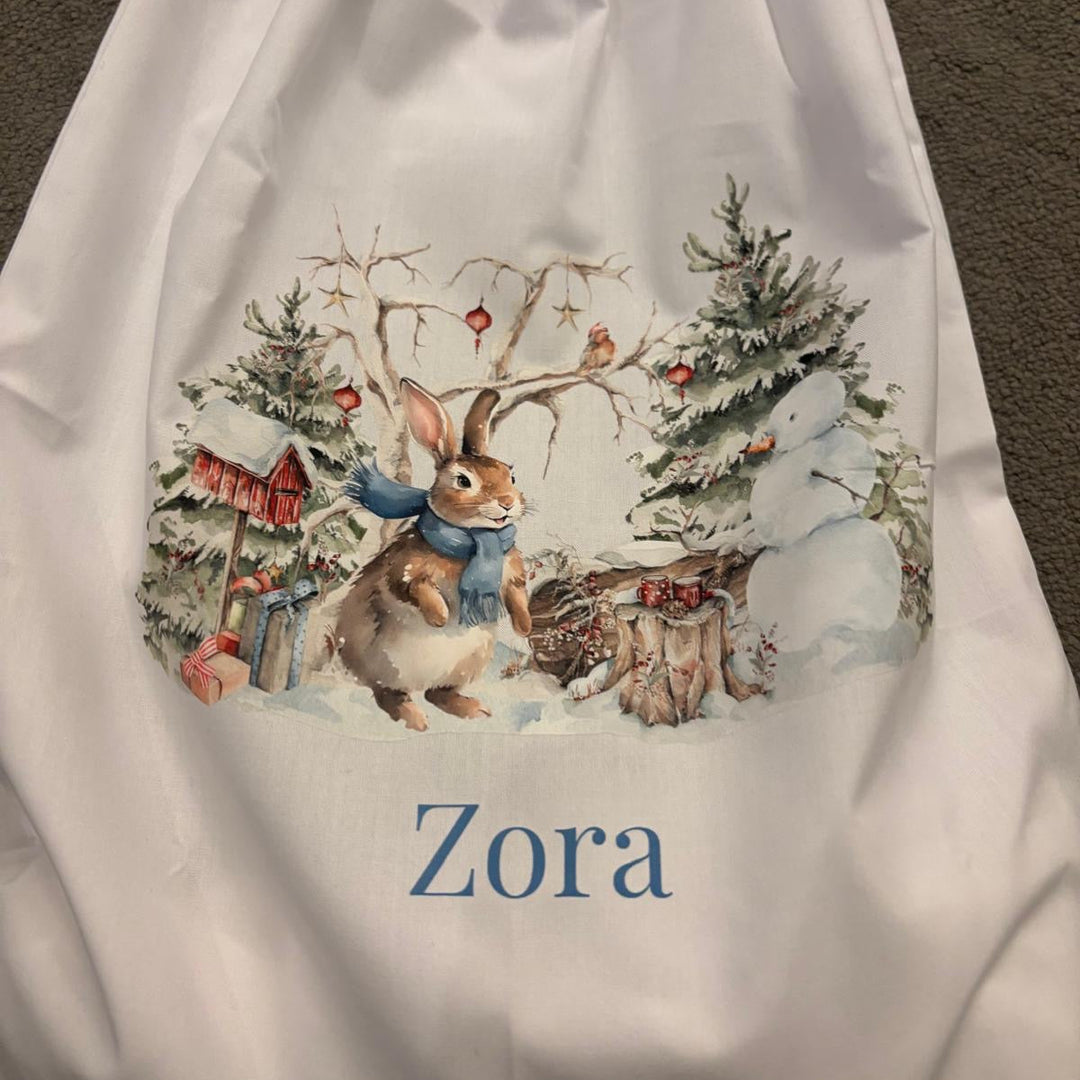 Personalised Magic of Christmas sack with bunny winter scene and name