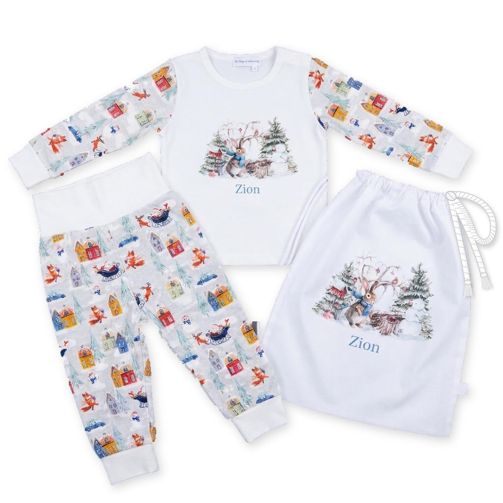 Personalised Christmas pyjamas with bunny scene and name, festive village print, and matching personalised Christmas sack