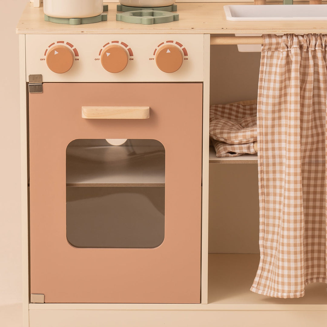 Rustic Wooden Kitchen with Cooking Utensils, Pans, Apron, Gloves and Leaf Light String - Chic Petit