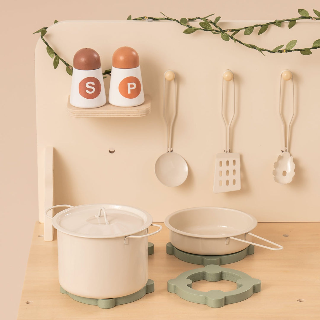 Rustic Wooden Kitchen with Cooking Utensils, Pans, Apron, Gloves and Leaf Light String - Chic Petit