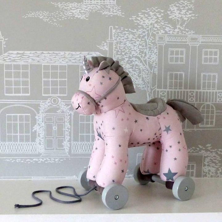 Pink and grey unicorn baby toy for motor skill development