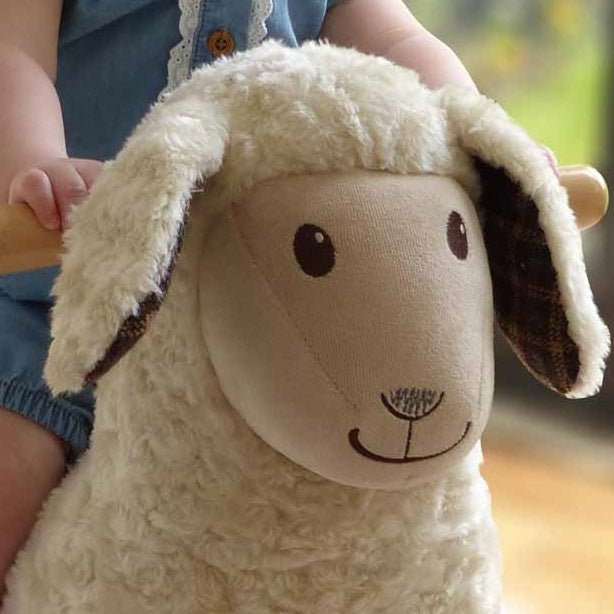 Baby rocking sheep toy with floppy ears and gentle smile — nursery keepsake