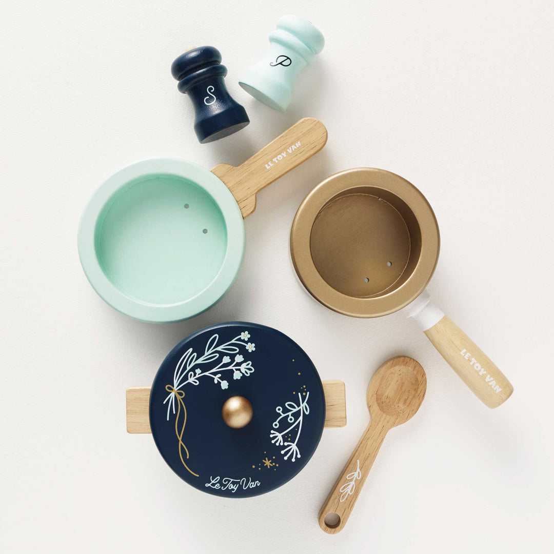 Children’s blue wooden play kitchen with utensils — sustainable toy